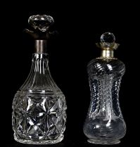 Two hallmarked silver collared cut glass decanters, larger 28cm.