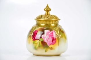 SPILSBURY FOR ROYAL WORCESTER; a potpourri and cover decorated with roses, height 10cm. Condition