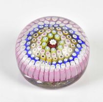 A 19th century millefiori paperweight dated 1848 to four canes, diameter 7cm. Condition Report: