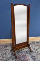 An Edwardian mahogany cheval mirror, with arched bevelled plate, height 171cm.