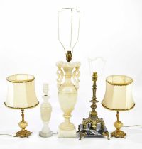 A group of five lamps to include two marble examples, height of largest 46cm.