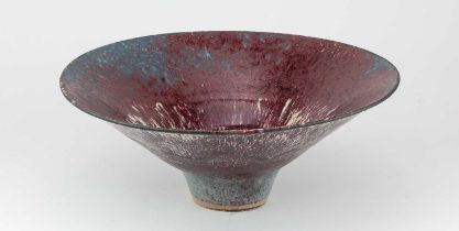 † ABDO NAGI (1941-2001); a large stoneware flared bowl partially covered in streaky copper red