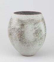 † BETTY BLANDINO (1927-2011); a stoneware vessel with textured surface covered in grey glaze with