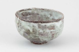 AKIKO HIRAI (born 1970); a stoneware chawan covered in pale green and lilac glaze, diameter 12.
