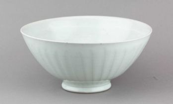 † ANDREW CROUCH (born 1955); a large fluted stoneware bowl covered in celadon glaze, impressed AC