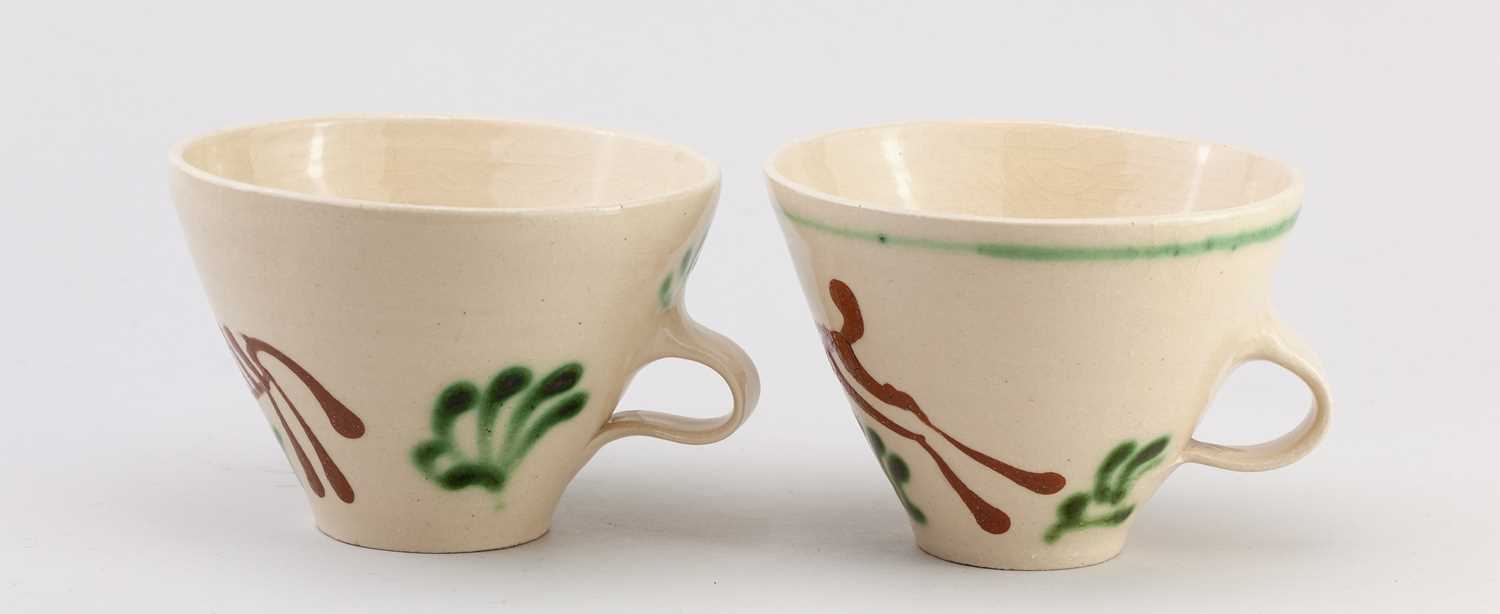† GEOFFREY FULLER (1936-2022); a pair of large slip decorated earthenware cups depicting a hare