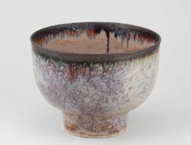 † ABDO NAGI (1941-2001); a deep stoneware pedestal bowl covered in mottled polychrome glaze with