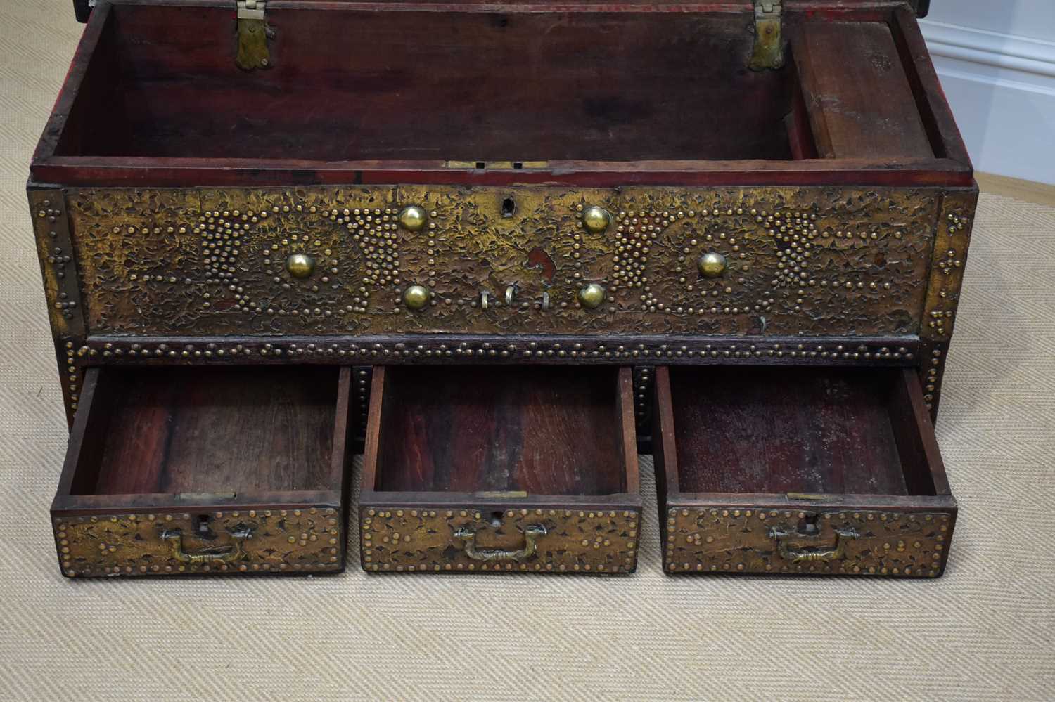 An early 20th century Zanzibar chest with applied studded decoration and hinged top above three - Image 2 of 6