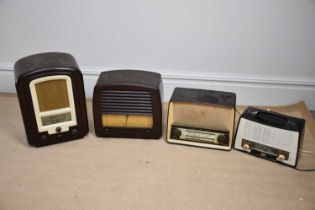 A group of four vintage bakelite radios including an Ekco, a Long Waves, a Stella and further