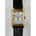 JAEGER-LECOULTRE; a gentleman's 18ct yellow gold Reverso wristwatch with subsidiary seconds hands