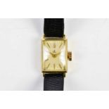 EBEL; a lady's 18ct gold cased wristwatch, the silvered dial set with batons, width 12mm, on a black