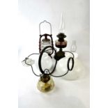 A collection of assorted lighting including a late Victorian oil lamp with chimney, hanging oil