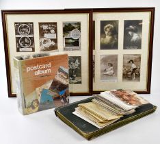 A collection of Edwardian and later postcards, in two albums and loose, including views around the