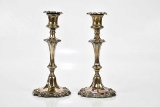 A pair of silver plated candle sticks of tapering form, height 25cm.