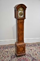 A 20th century walnut cased eight day grandmother clock, with Whittington and Westminster chimes,