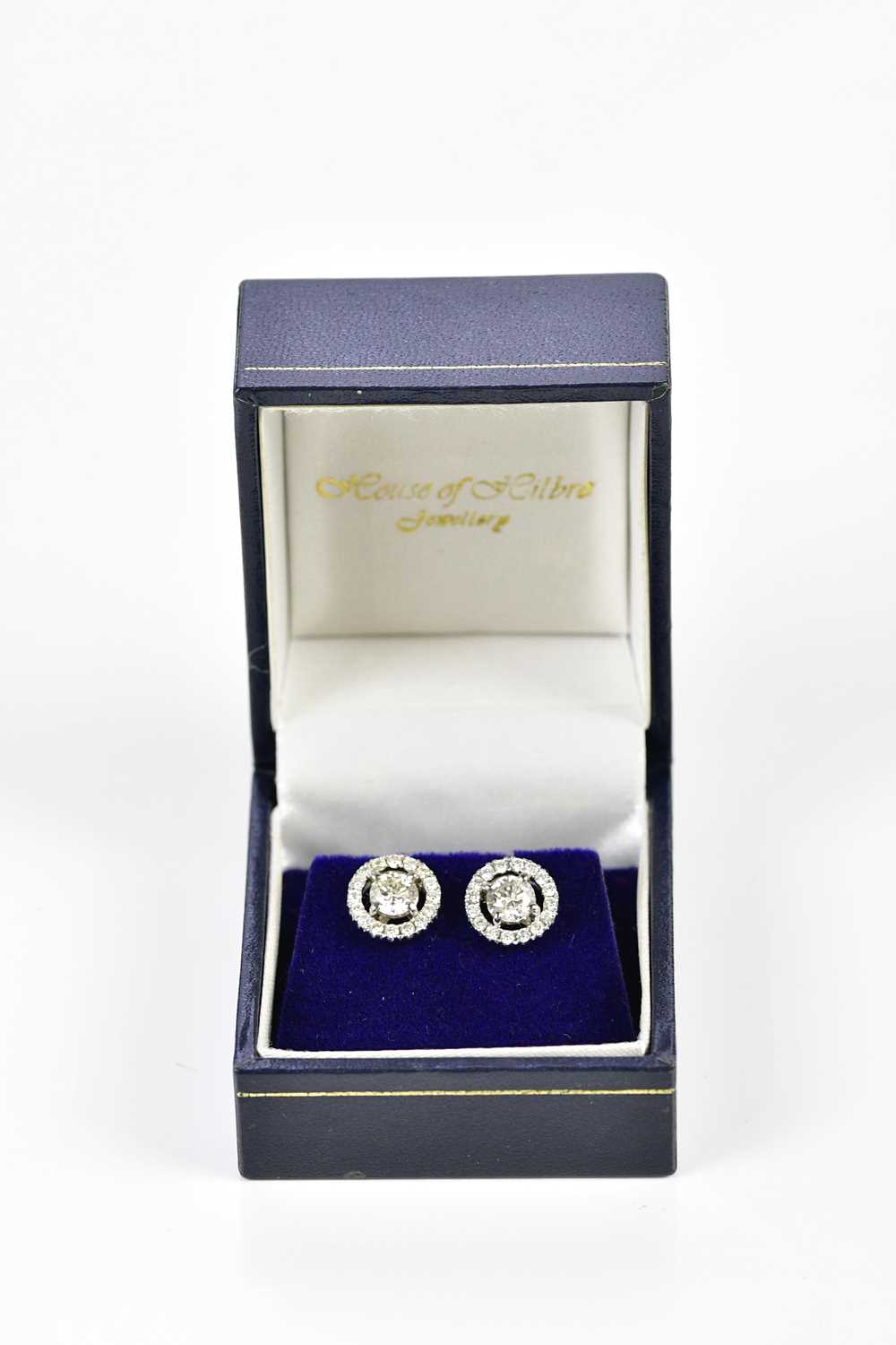 A pair of 18ct white gold and diamond halo set ear studs, each with central round brilliant cut - Image 5 of 5