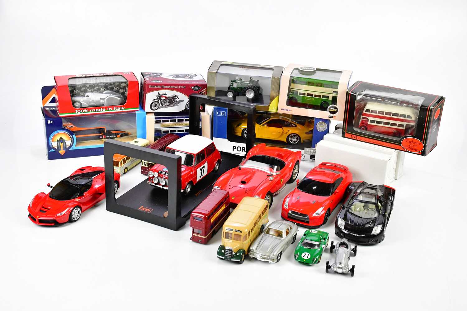 A large quantity of diecast model vehicles and books, various manufacturers including Burago.