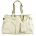 YVES SAINT LAURENT; a cream pebbled leather 'Y' bag with gold tone hardware buckles, and maker's