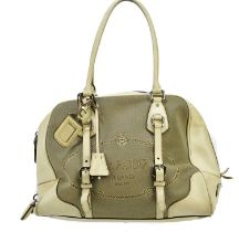 PRADA; a beige Jacquard canvas logo and cream leather handbag, with silver tone hardware, twin