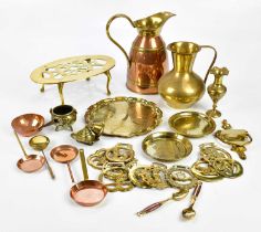 A collection of brass and copper items including kettles, warmers, dishes, jugs, etc.