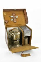 A 1940s cased picnic/camping set, including kettle and stove, tins, two trays and two teaspoons.