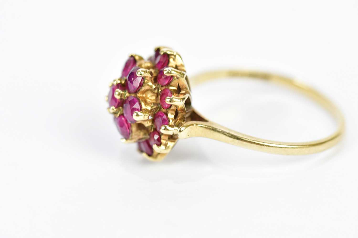 A 9ct yellow gold dress ring, set with a melee of red stones, size N 1/2, approximate weight 3.5g. - Image 2 of 3