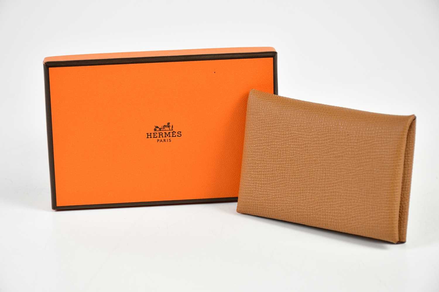 HERMÈS; an unused Calvi Epsom leather gold brown card holder, in original box with receipt, 10.5 x