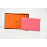 HERMÈS; an unused Calvi calfskin leather card holder Rose Azalee, in original box with paperwork, 10