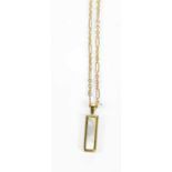 A 9ct yellow gold double sided rectangular pendant suspended on a fine link chain, combined 6g.