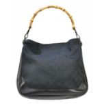 GUCCI; a black monogram canvas GG handbag with bamboo handle and black leather trim, with canvas