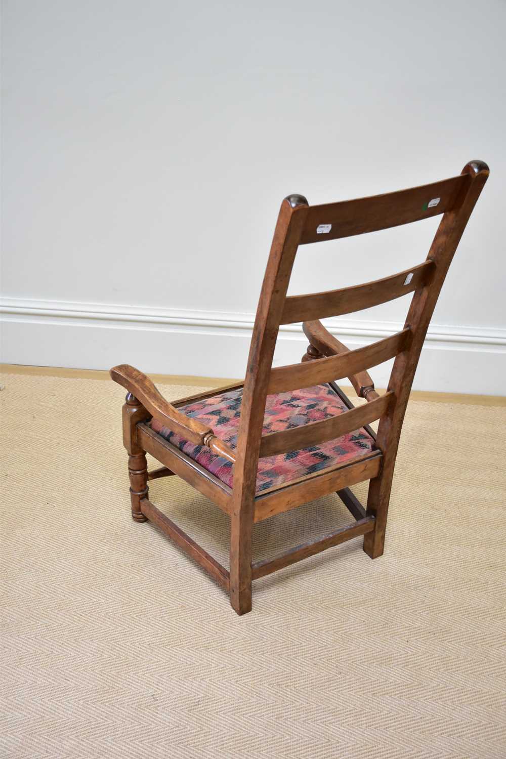 A 19th century ladderback elbow chair with drop-in seat. - Image 3 of 3