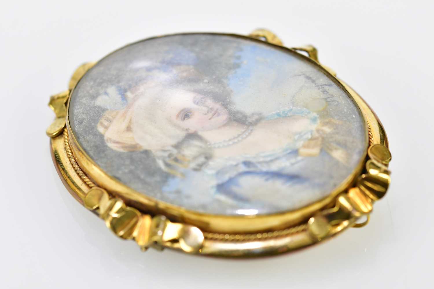 X A late 19th century yellow metal framed oval portrait miniature brooch, hand painted with the - Image 3 of 4