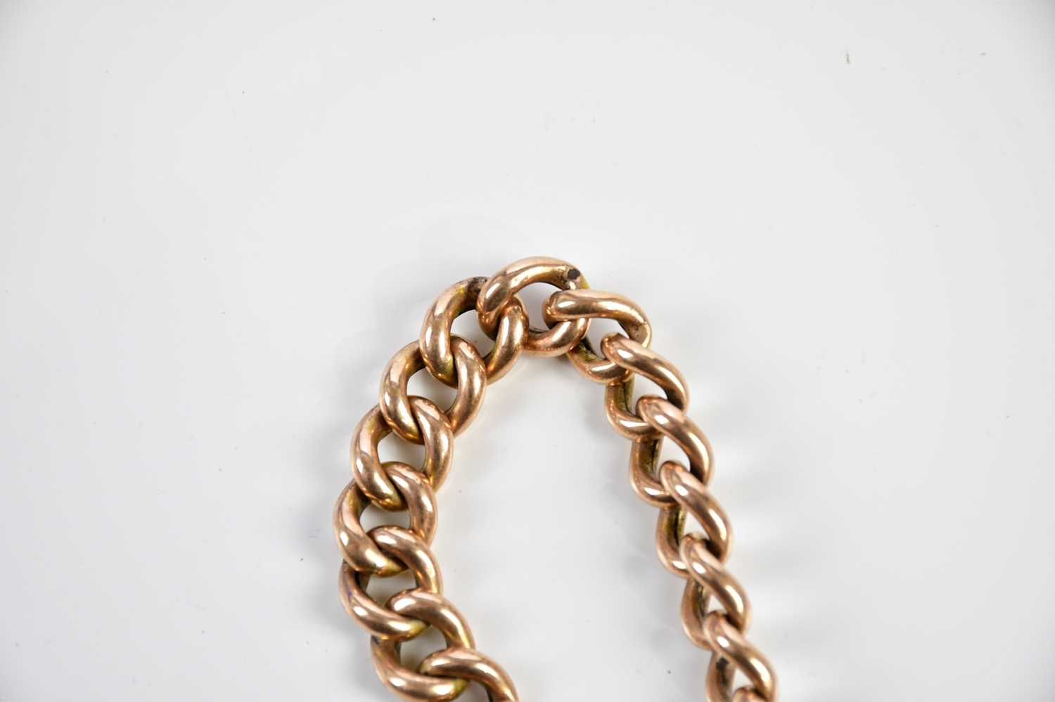 A 9ct yellow gold curb link bracelet with padlock clasp, approx 15.2g. - Image 3 of 4