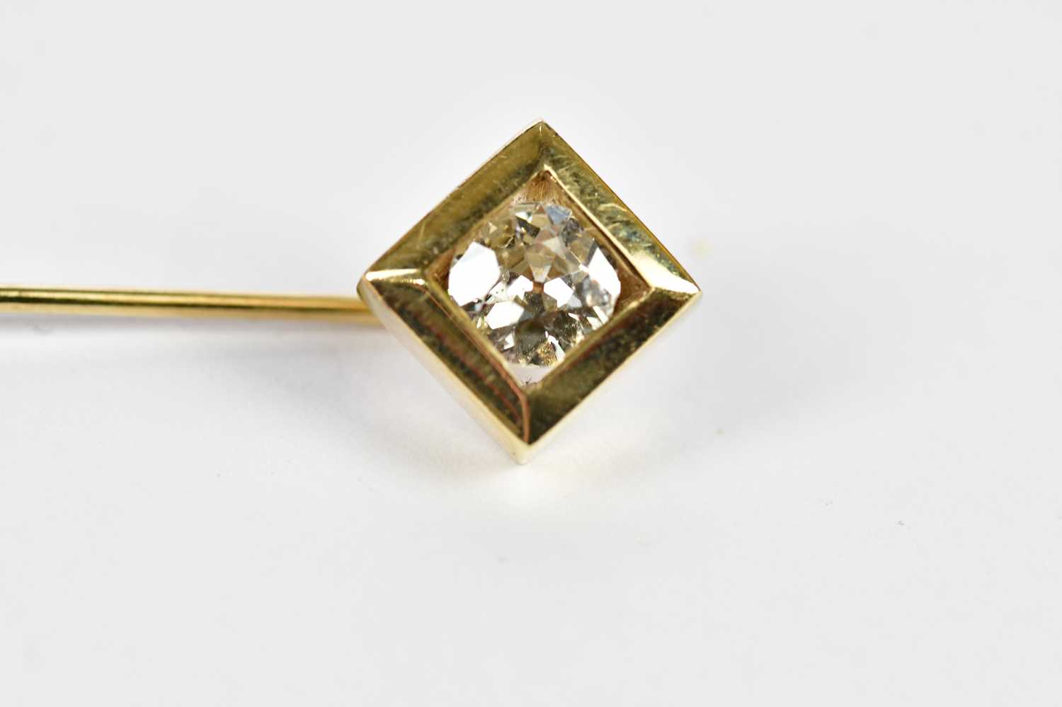A yellow metal stick pin with collet set round brilliant cut diamond weighing approx. 0.60cts, - Image 2 of 3
