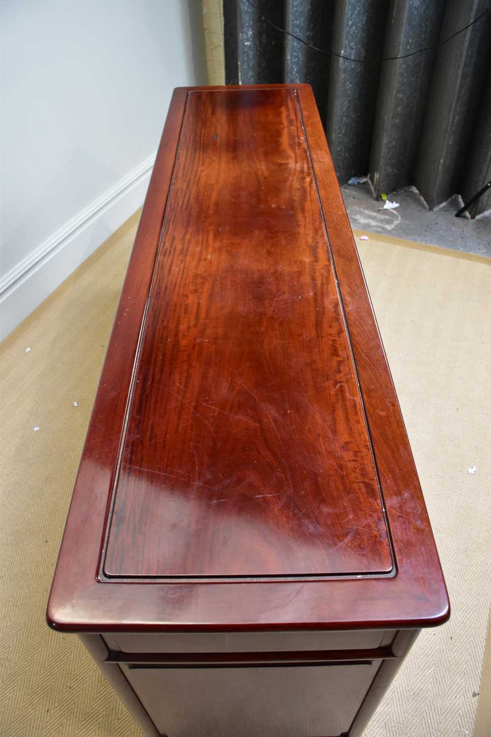 A 20th century Chinese rosewood sideboard with four drawers above four panelled cupboard doors, - Image 4 of 4