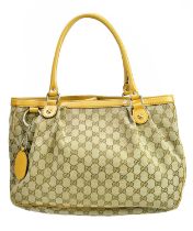 GUCCI; a black MM canvas and beige leather Sukey handbag, with two top handles and a large logo