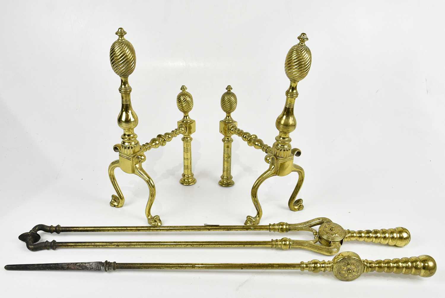 A pair of late 19th century cast brass fire irons, comprising tongs and poker, longest 69cm, and a