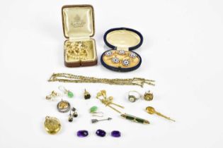 An interesting collection of jewellery, including a cased set of shirt studs, Mizpah locket, fobs,