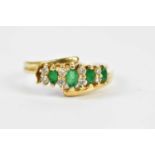 A 14ct yellow gold emerald and diamond dress ring with swept shoulders, size O, approx 3.2g, af.