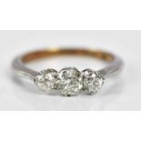 An 18ct yellow gold three stone graduated diamond ring, the central stone weighing approx 0.15ct,