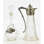 A late Victorian cut glass claret jug with silver plated mount and handle and mythical beast