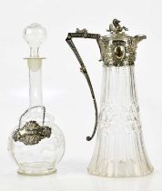 A late Victorian cut glass claret jug with silver plated mount and handle and mythical beast