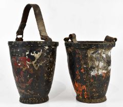 A pair of Victorian studded leather mounted fire buckets, each with painted shields, height 32cm (