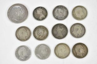A Queen Victoria 1887 Jubilee silver coin set, crown to three pence, with a 1902 crown, and eleven