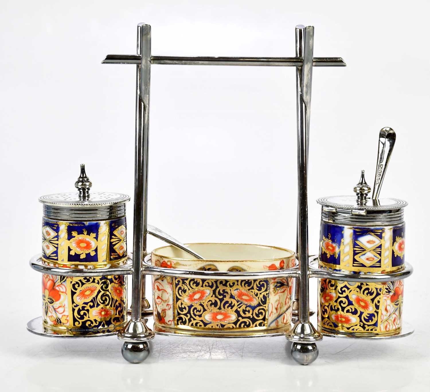 JAMES DEAKIN & SONS; an Arts and Crafts silver plated condiment set with Davenport Imari ceramic