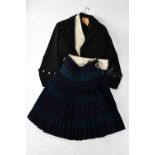 A Blackwatch kilt, Glengarry cap, and Scottish attire. Condition Report: There is no size label on