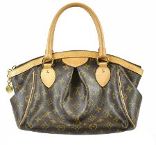 LOUIS VUITTON; a Monogram coated canvas Tivoli PM handbag with gold tone base stud with cow hide