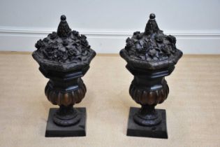 A large pair of bronze urns with floral decoration to the tops, height 75cm.