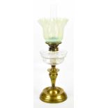 A Victorian brass oil lamp, with vaseline glass shade and Palmer & Co duplex wick holder above the