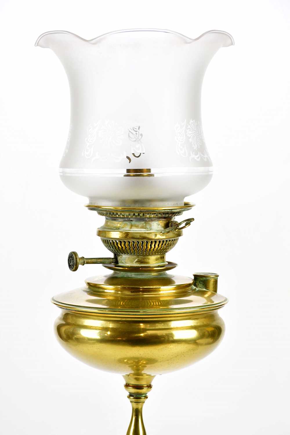 An early 20th century brass oil lamp with replacement frosted glass shade, on three scrolling - Image 2 of 3